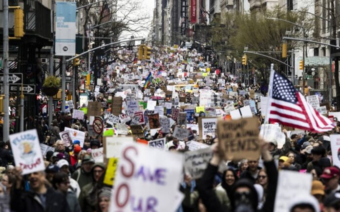 American protesters to Trump and Musk : HANDS OFF