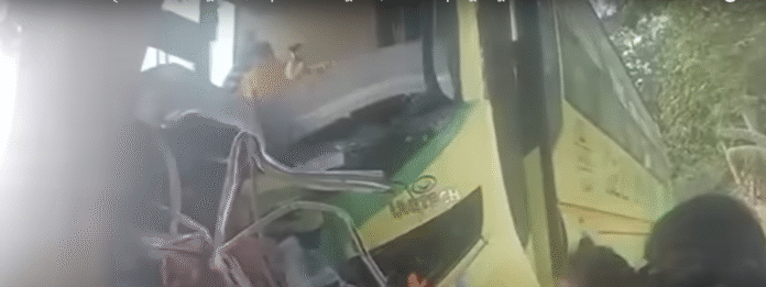 Damaged bus after collision with passenger van on highway in Nadia, West Bengal, with emergency responders and bystanders at the scene | PMN Patralok
