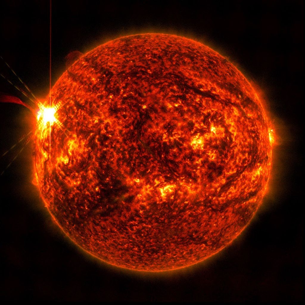 NASA’s Solar Dynamics Observatory captured this image of a solar flare, seen as the bright flash on the left, on May 14 