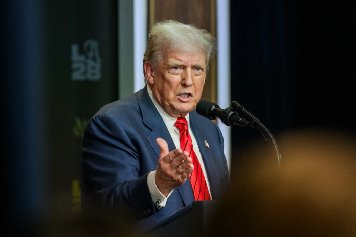 U.S. President Donald Trump addressing a public event, defending his administration’s immigration and visa policy changes.