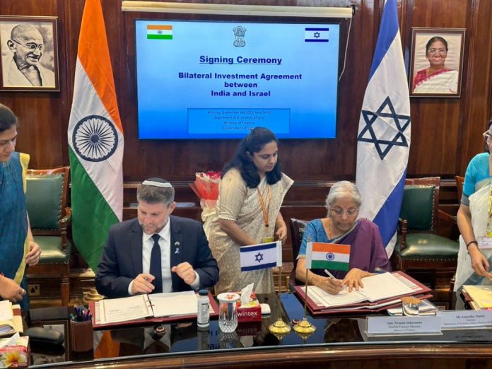 Union Finance Minister Nirmala Sitharaman and Israel’s Finance Minister Bezalel Smotrich sign the Bilateral Investment Agreement in New Delhi, marking a historic milestone to strengthen economic and strategic ties between India and Israel. (Image Credit: @FinMinIndia via X)