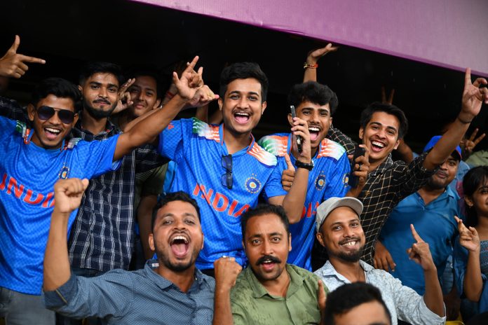 Fans cheering from the stands